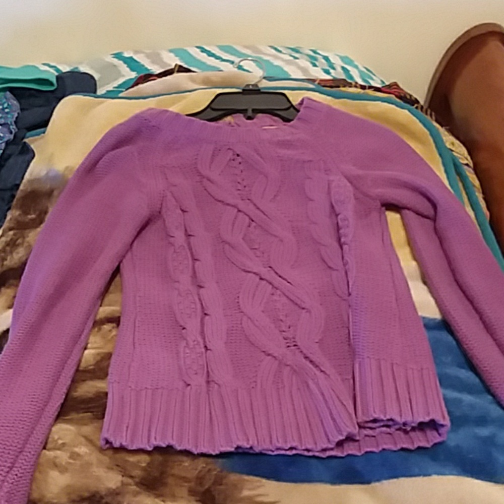 A purple sweater
